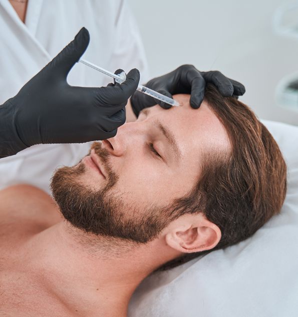 Male patient during a dermal filler treatment in Suwanee, GA